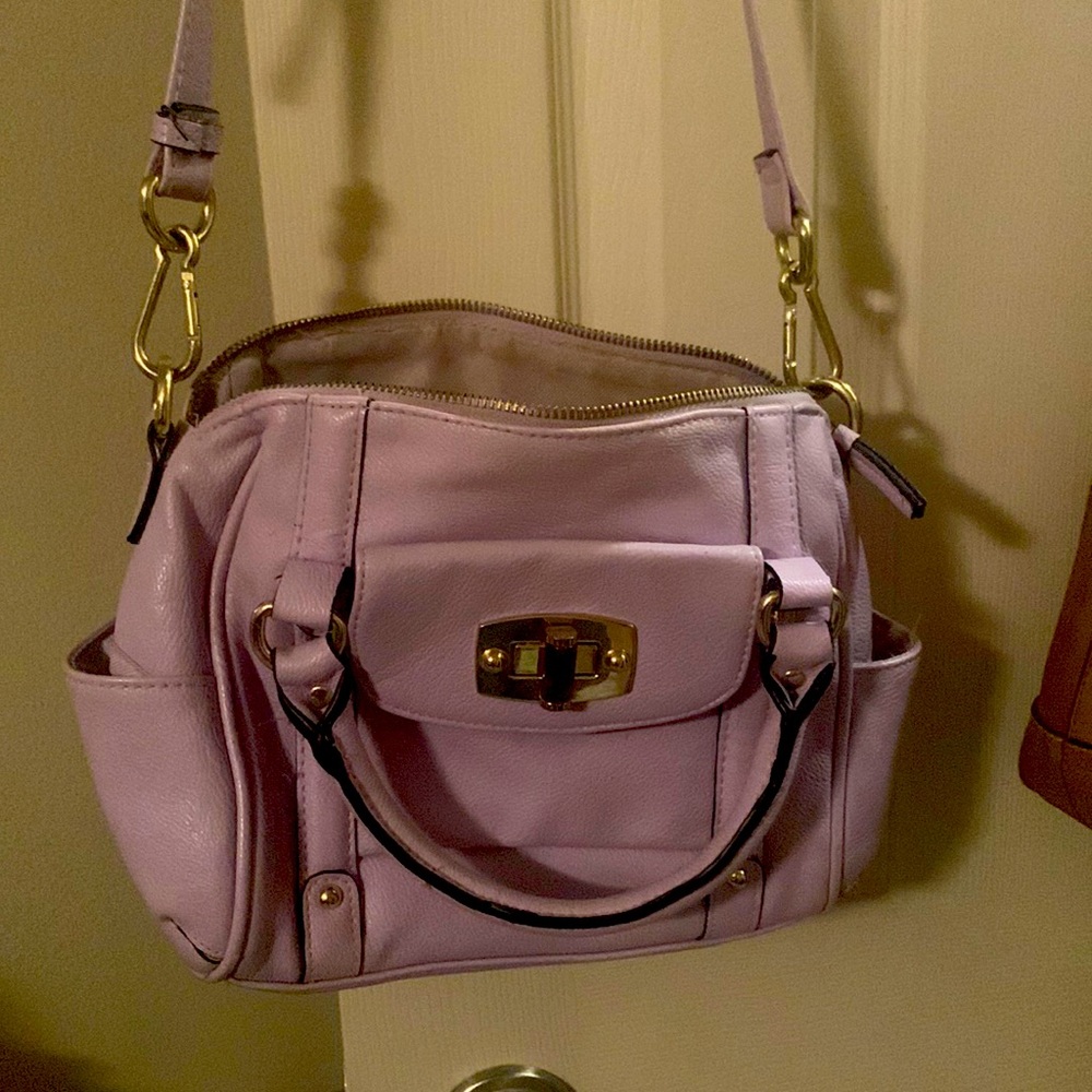 Purple purse. Cross body. Slightly used. Good condition
